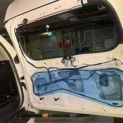 Hardwired dashcam installation with neatly managed wiring behind interior trim